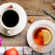 Tea cups and fruits on top a surface